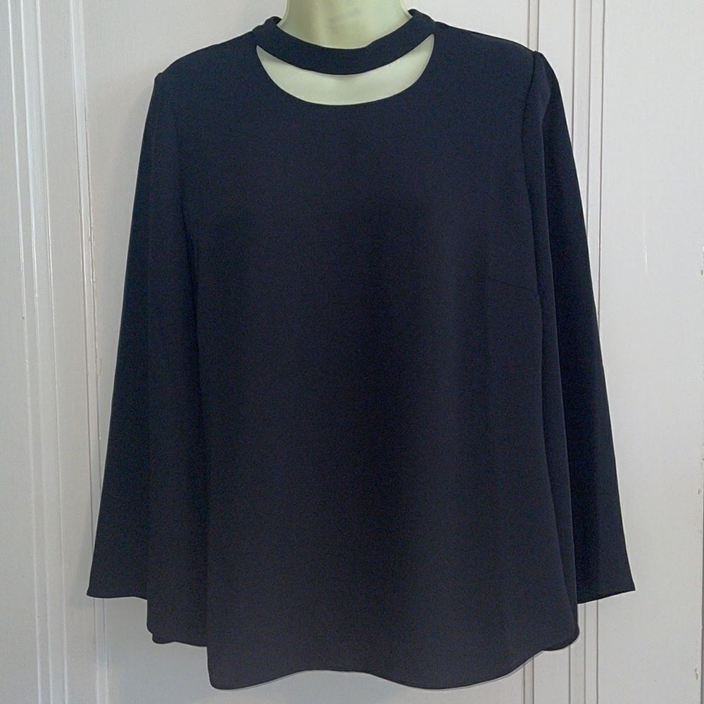 Chico’s black polyester blouse with bell sleeves & half moon cutout at neck‎